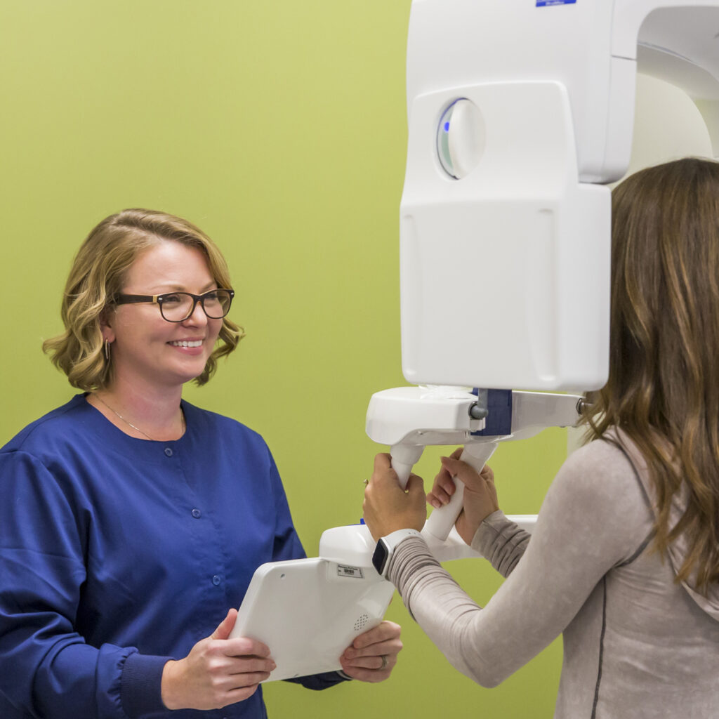 xray tech giving a patient a dental xray